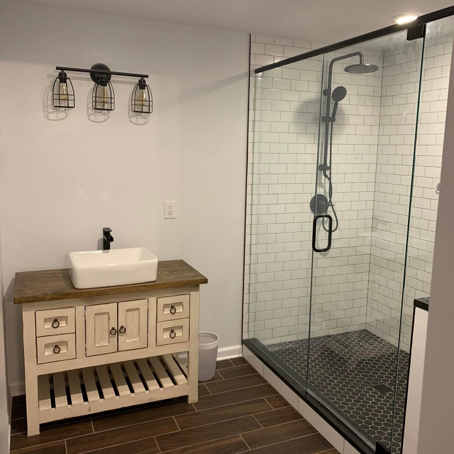 Farmhouse bathroom with tiled shower