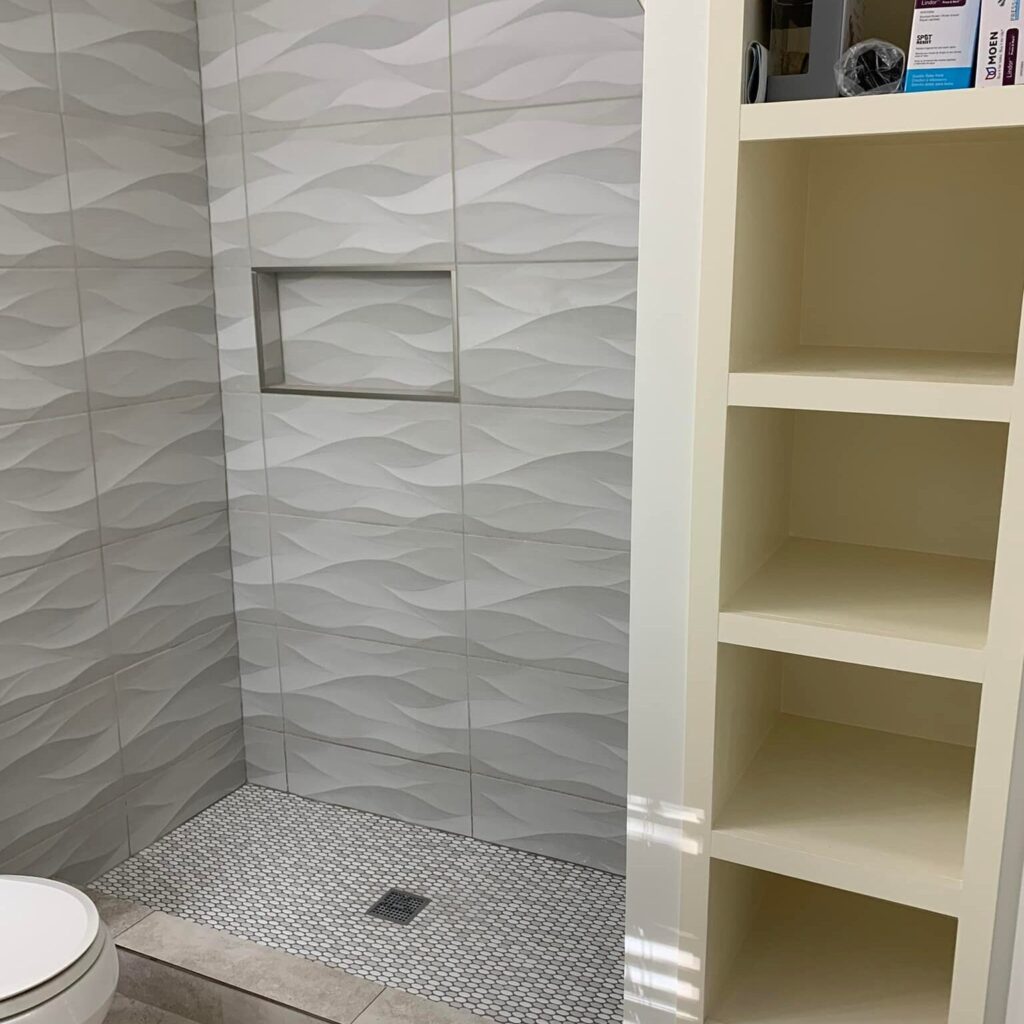 Gray wavy tile used in shower remodel