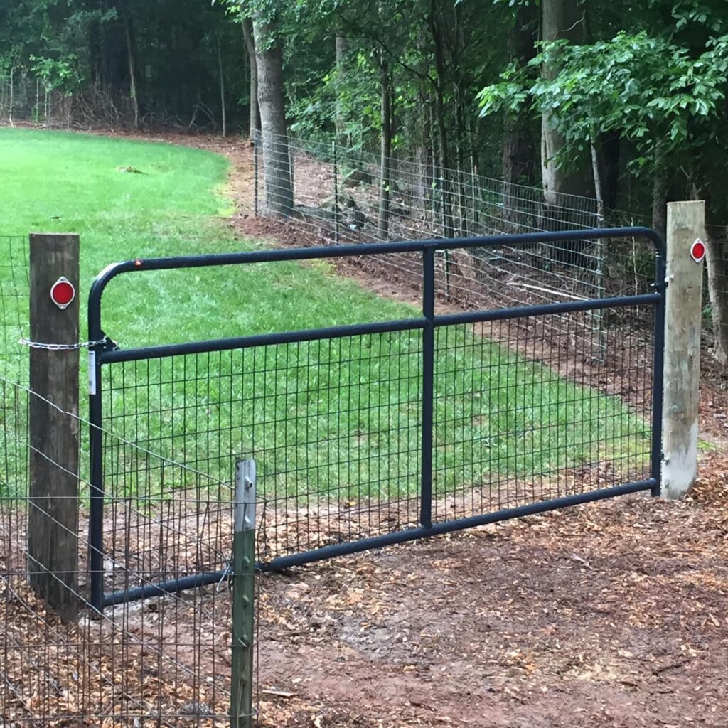 Dark gate hanging from fence